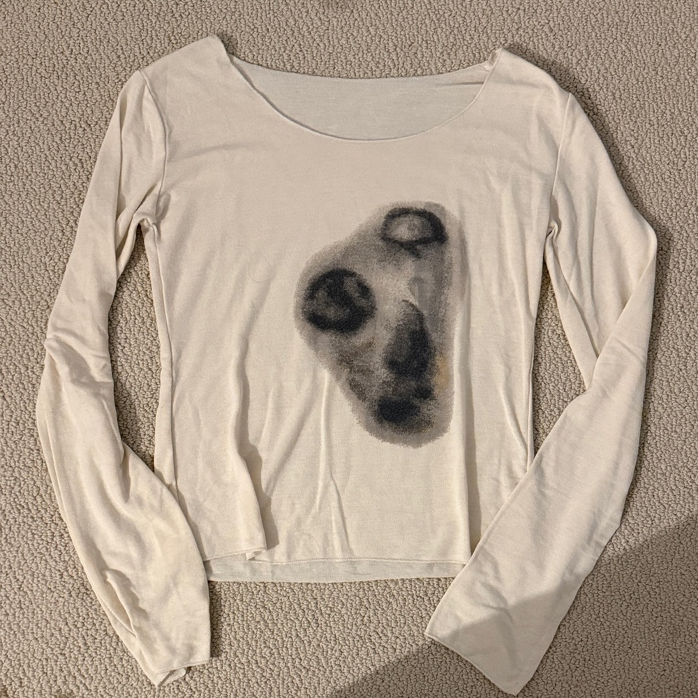 Elegant Cream Long Sleeve Top with Artistic Design